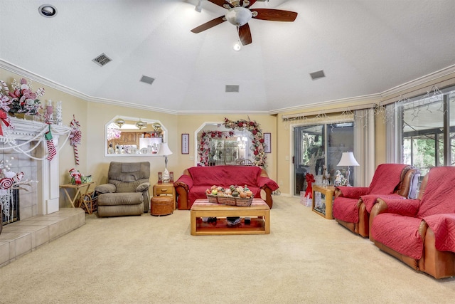 carpeted living room with a textured ceiling, ceiling fan, lofted ceiling, and ornamental molding