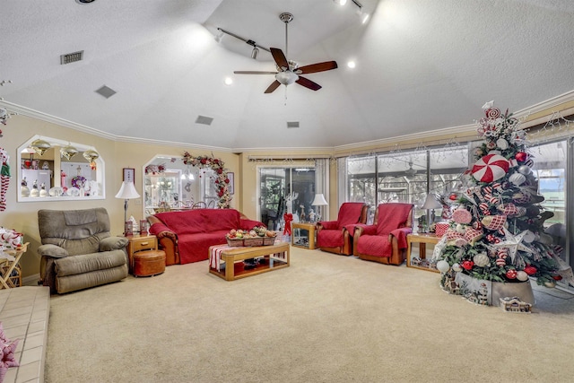 carpeted living room featuring rail lighting, a textured ceiling, vaulted ceiling, ceiling fan, and crown molding