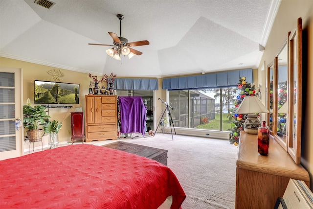 carpeted bedroom featuring ceiling fan, vaulted ceiling, and ornamental molding