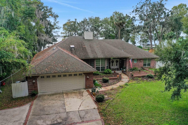 view of front of home with a garage and a front yard