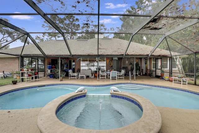 view of swimming pool with an in ground hot tub, a lanai, and a patio area