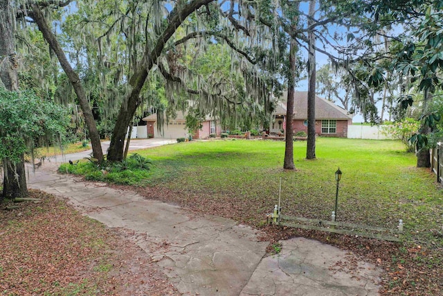 view of yard featuring a garage