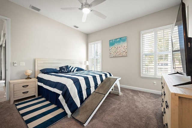 bedroom with vaulted ceiling, ceiling fan, and dark colored carpet