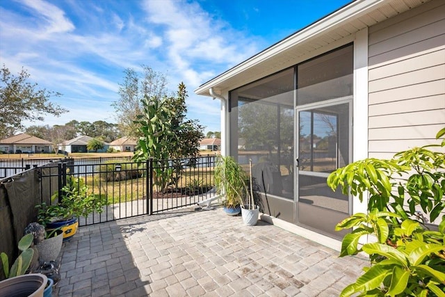 view of patio / terrace with a sunroom