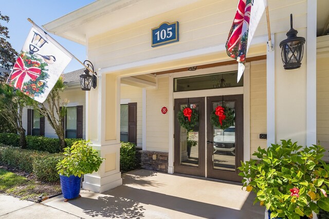 property entrance featuring french doors