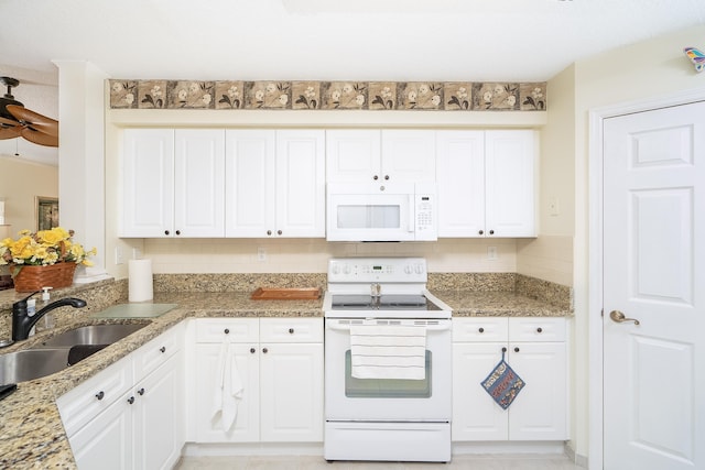 kitchen featuring white cabinetry, sink, ceiling fan, light stone countertops, and white appliances