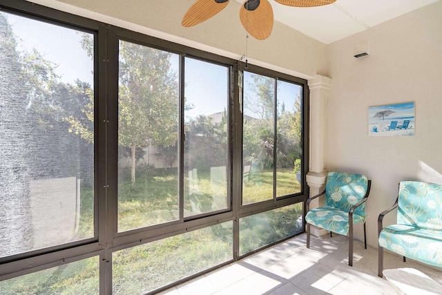 sunroom / solarium with plenty of natural light and ceiling fan