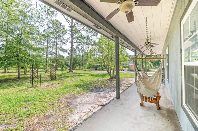 4405 Alvin St, Hastings, FL 32145 - view of patio featuring a ceiling fan and view of wooded area