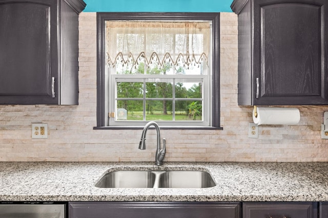 4405 Alvin St, Hastings, FL 32145 - kitchen with a sink, decorative backsplash, and dark brown cabinets