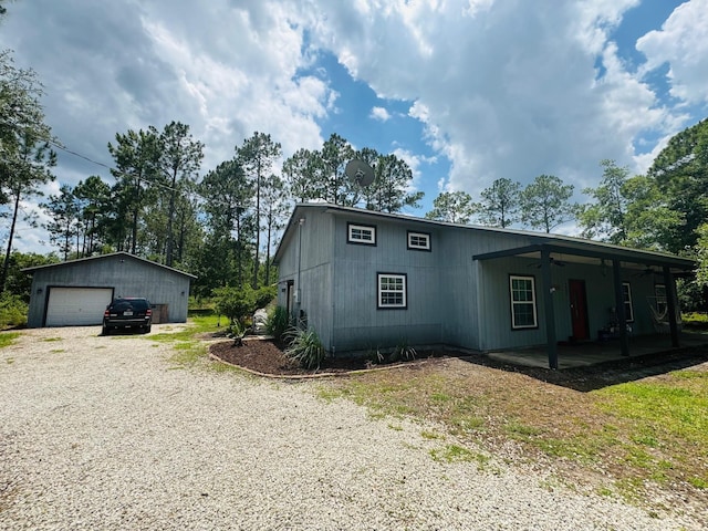 4405 Alvin St, Hastings, FL 32145 - view of front of house with a ceiling fan, a garage, and an outdoor structure