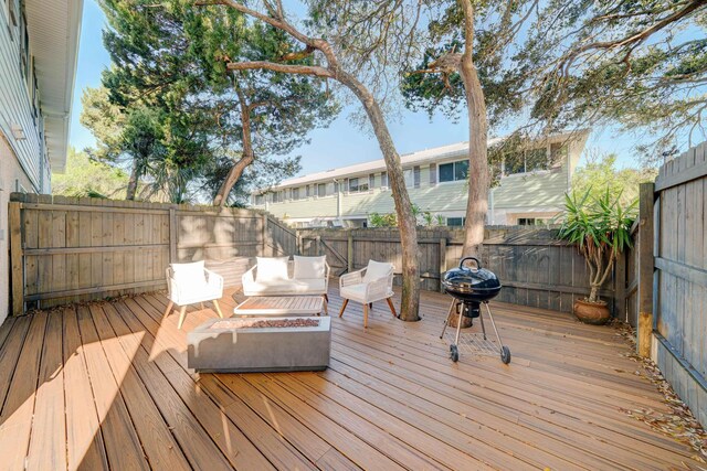108 A St Unit A, Saint Augustine, FL 32080 - wooden terrace with a fenced backyard and an outdoor living space with a fire pit