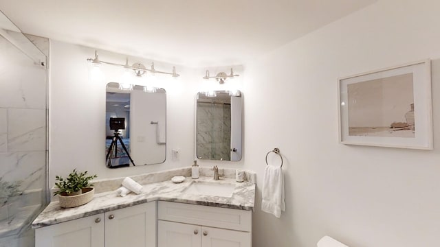 full bath with a shower and vanity