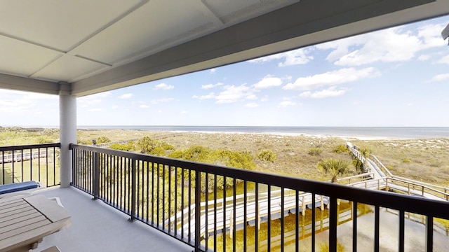 balcony with a view of the beach and a water view