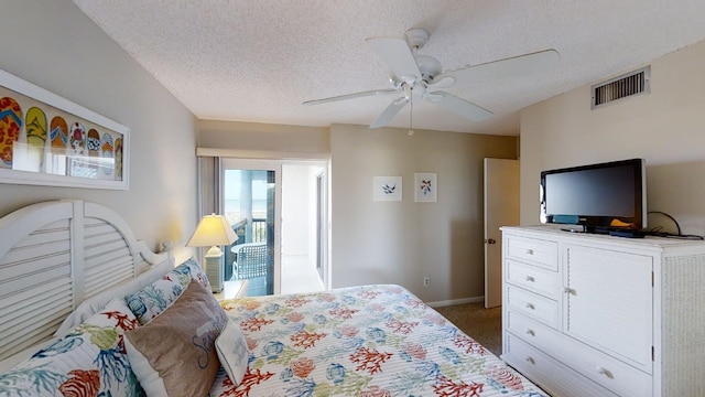 bedroom with visible vents, light carpet, ceiling fan, a textured ceiling, and baseboards