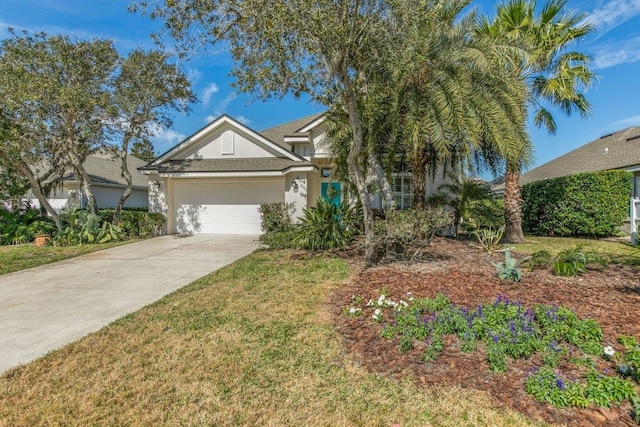 view of front of property featuring a garage and a front yard