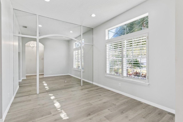 unfurnished dining area with light hardwood / wood-style flooring