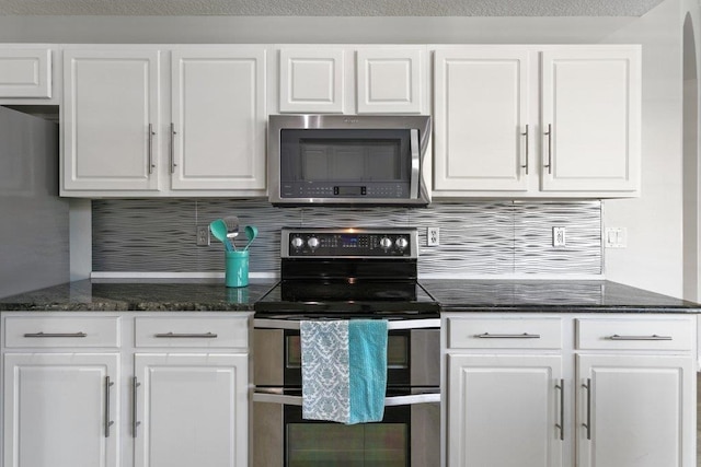 kitchen with white cabinetry, appliances with stainless steel finishes, and decorative backsplash