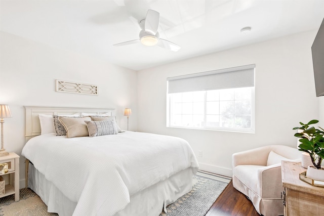 bedroom featuring hardwood / wood-style floors and ceiling fan