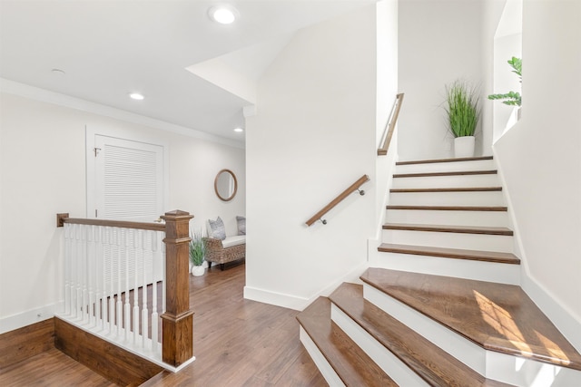211 2nd St, Saint Augustine, FL 32080 - staircase with recessed lighting, wood finished floors, and ornamental molding
