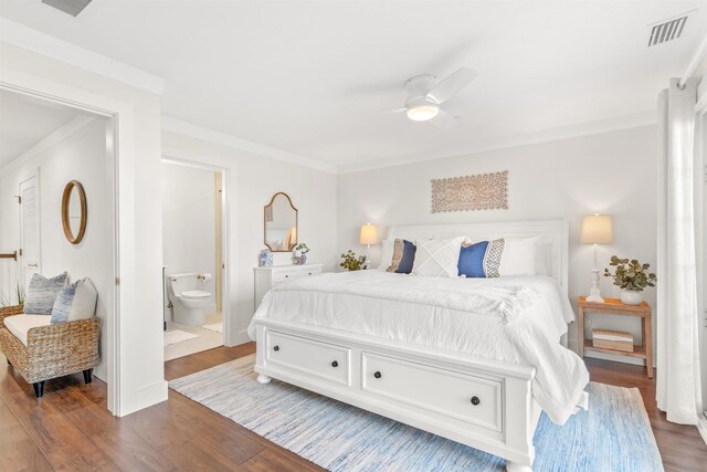 211 2nd St, Saint Augustine, FL 32080 - bedroom featuring wood finished floors, crown molding, connected bathroom, and ceiling fan