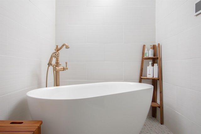 211 2nd St, Saint Augustine, FL 32080 - full bathroom with tile walls and a freestanding tub
