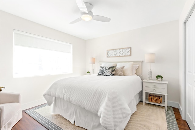 bedroom featuring wood-type flooring, a closet, and ceiling fan