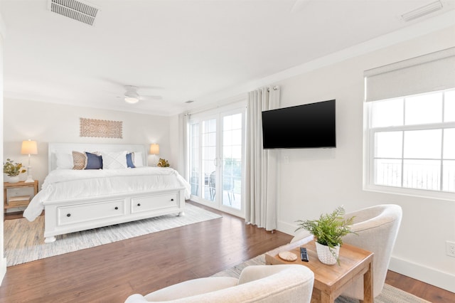 bedroom featuring ceiling fan, access to exterior, light wood-type flooring, and crown molding