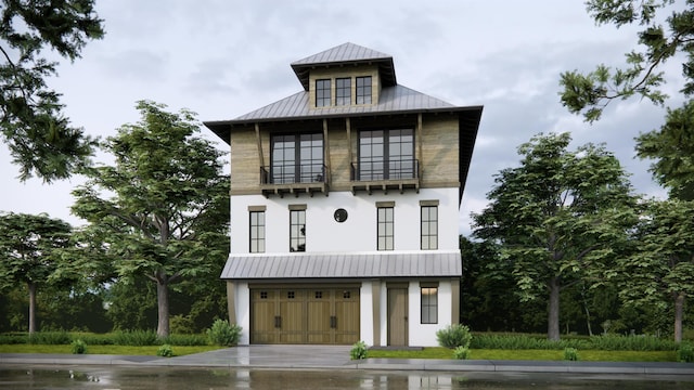 view of front facade featuring a balcony and a garage