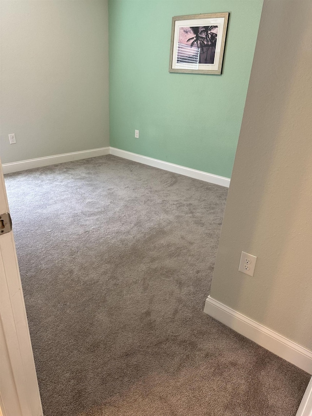 unfurnished room with carpet floors