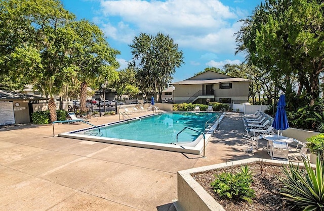 view of pool featuring a patio