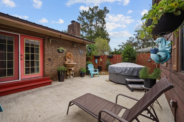 view of patio / terrace featuring a hot tub