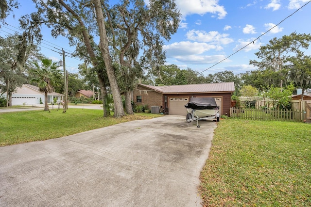 view of front of house with a front lawn and a garage