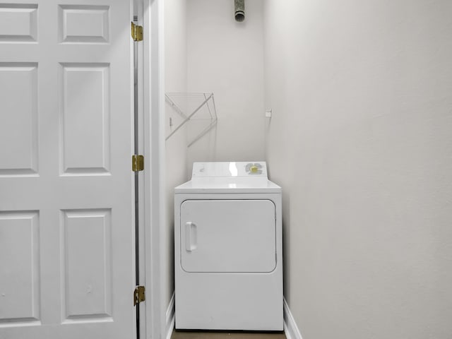 clothes washing area featuring washer / dryer and laundry area