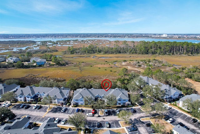 drone / aerial view with a residential view and a water view