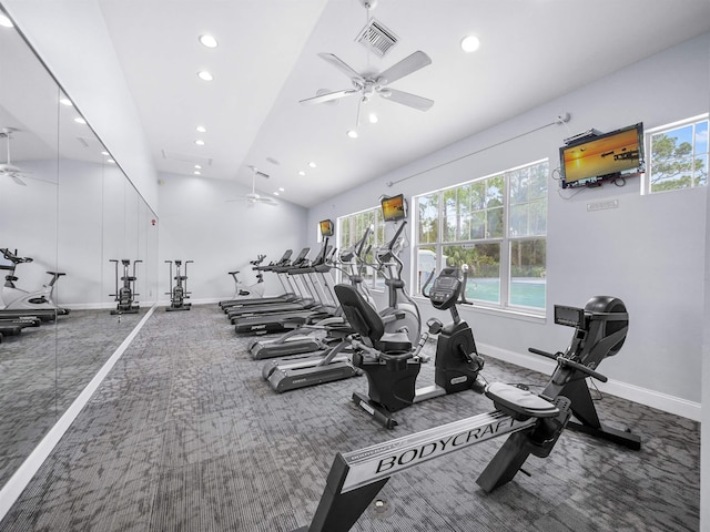 exercise room featuring visible vents, carpet, a ceiling fan, and vaulted ceiling