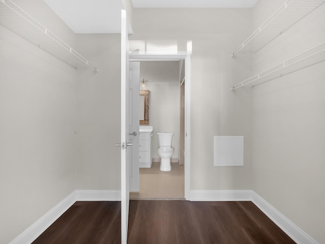 spacious closet with wood finished floors