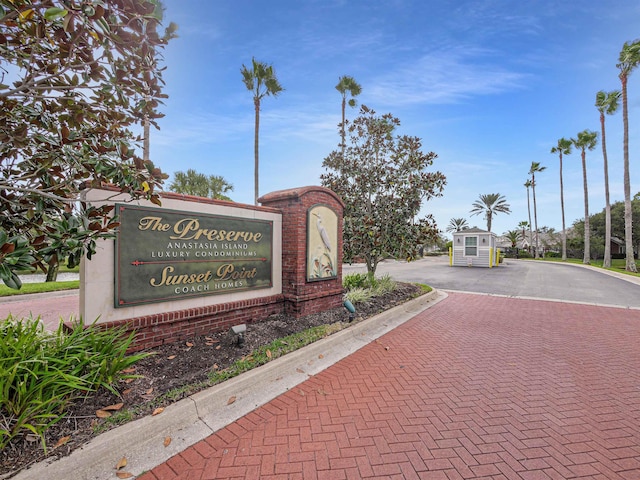 community / neighborhood sign with driveway