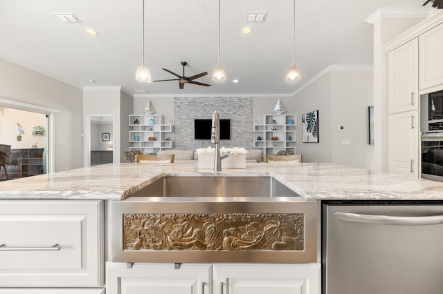 kitchen with visible vents, ceiling fan, stainless steel appliances, decorative light fixtures, and open floor plan