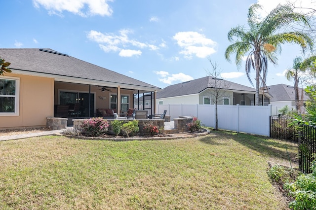 view of yard featuring a patio area, a fenced backyard, and ceiling fan