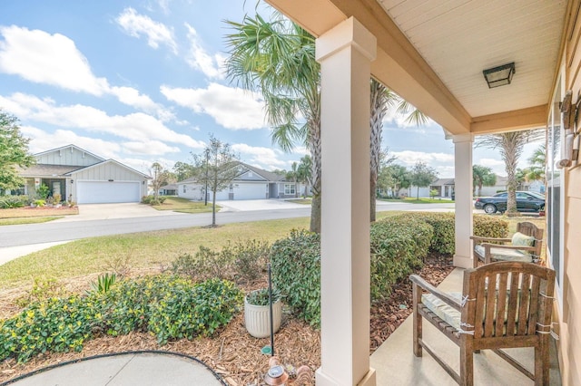 view of patio / terrace featuring a porch and a residential view