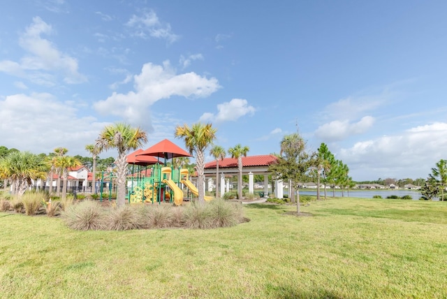 community playground with a lawn and a water view