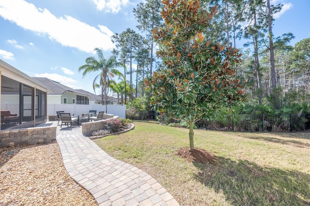 view of yard featuring a patio area and a fenced backyard