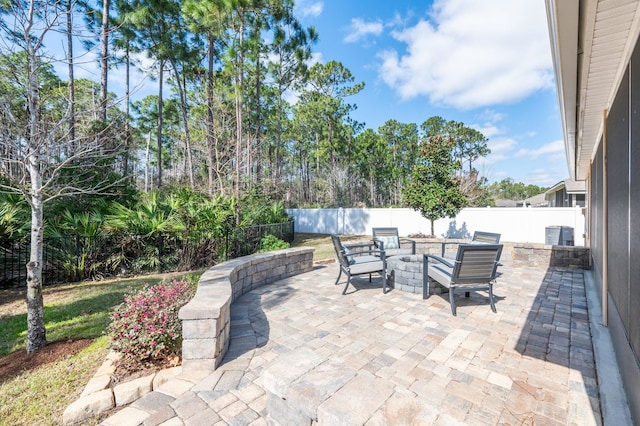 view of patio / terrace featuring central air condition unit and a fenced backyard