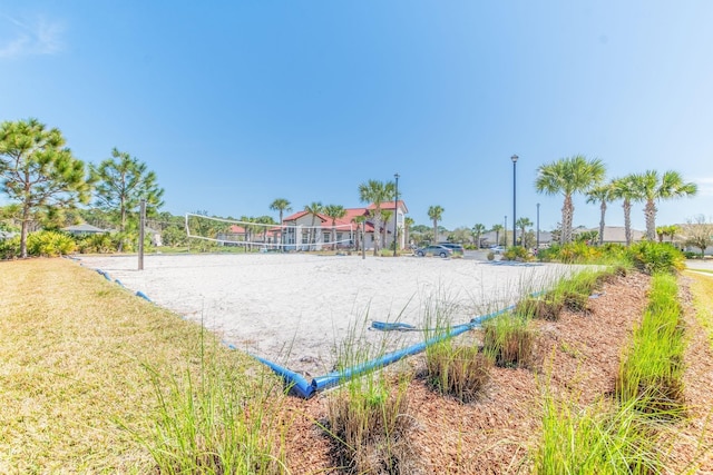 view of community featuring a yard and volleyball court