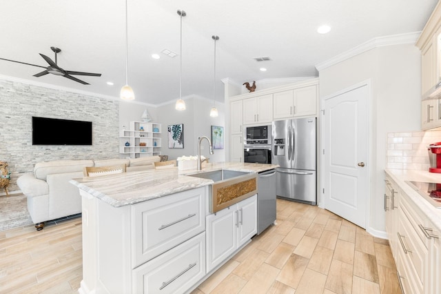 kitchen featuring visible vents, a ceiling fan, a sink, appliances with stainless steel finishes, and white cabinets