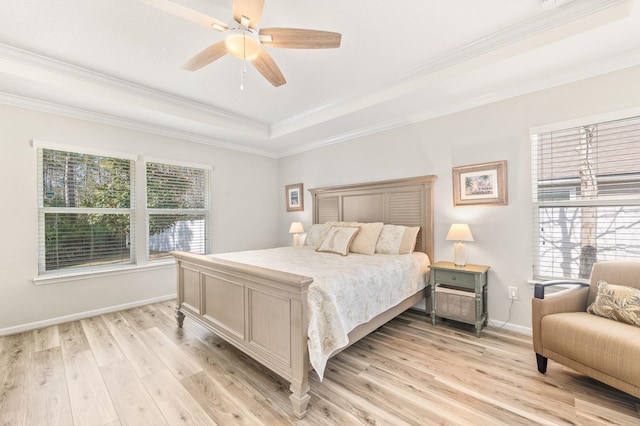 bedroom with light wood-type flooring, multiple windows, baseboards, and crown molding