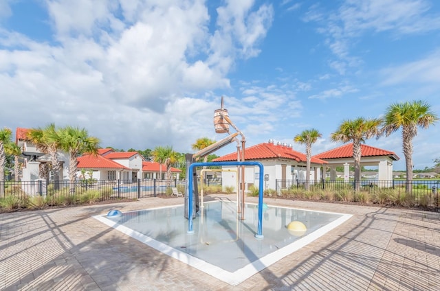 view of community featuring a gazebo, a residential view, and fence