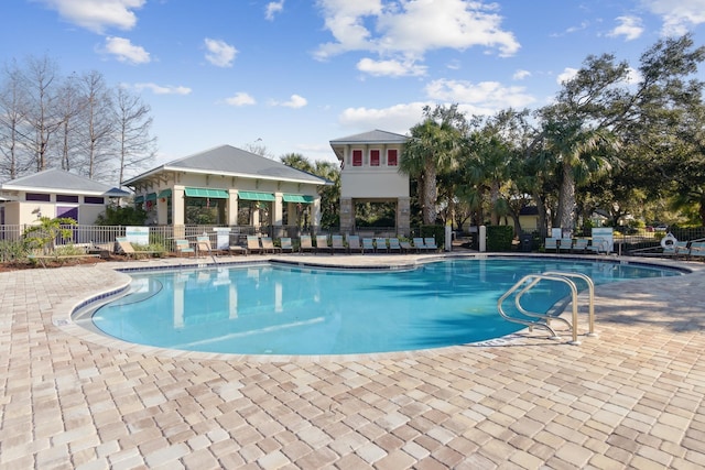 pool featuring a patio and fence