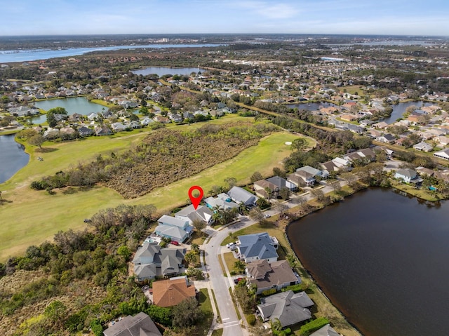 bird's eye view with a water view and a residential view