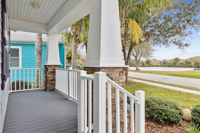 exterior space featuring a water view and covered porch